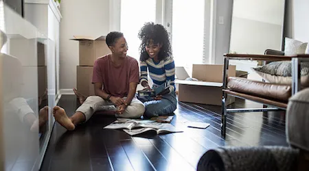 Couple sitting on the floor talking